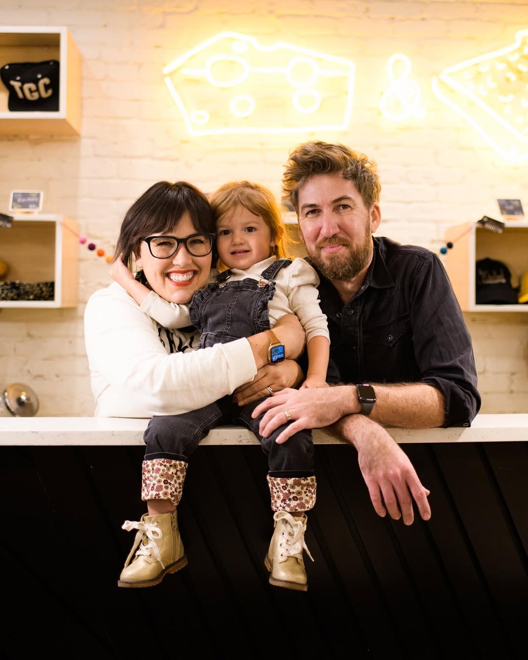 Crystal De Luna-Bogan and Joseph Bogan with their daughter at The Grilled Cheeserie